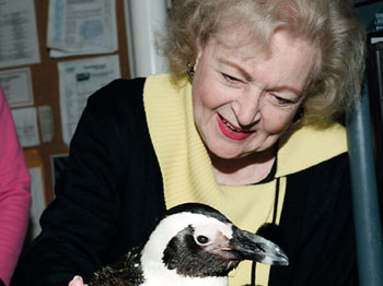 Betty White with a penguin